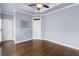 Bedroom with hardwood floors and a tray ceiling offers neutral paint and space at 818 Highland Green Ne Way # 818, Atlanta, GA 30306