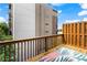 Outdoor deck with wood railing offers an elevated view of the surrounding neighborhood at 818 Highland Green Ne Way # 818, Atlanta, GA 30306