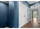 Hallway with blue walls, wood flooring and a large white closet at the top of the stairwell at 818 Highland Green Ne Way # 818, Atlanta, GA 30306
