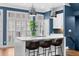 Bright kitchen featuring a marble island, modern pendant lighting, and white cabinets at 818 Highland Green Ne Way # 818, Atlanta, GA 30306