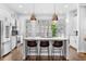 Bright kitchen boasts a center island with seating, stainless steel appliances, and generous natural light from window shutters at 818 Highland Green Ne Way # 818, Atlanta, GA 30306