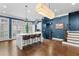 Modern kitchen with a marble island, pendant lighting, and blue walls at 818 Highland Green Ne Way # 818, Atlanta, GA 30306