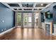 Living room with coffered ceiling, fireplace, and access to the deck at 818 Highland Green Ne Way # 818, Atlanta, GA 30306