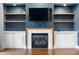 Living room with a fireplace and built-in shelves and cabinets at 818 Highland Green Ne Way # 818, Atlanta, GA 30306