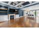 Spacious living room featuring hardwood floors, coffered ceiling and a fireplace at 818 Highland Green Ne Way # 818, Atlanta, GA 30306