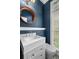 Stylish powder room featuring a marble vanity and modern fixtures at 818 Highland Green Ne Way # 818, Atlanta, GA 30306