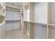 Spacious walk-in closet features built-in shelves, drawers, and clothing rods for easy organization at 818 Highland Green Ne Way # 818, Atlanta, GA 30306