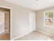 Bedroom featuring light walls and views through the window at 8199 Cousins St, Douglasville, GA 30134