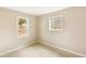 Bedroom with two windows allowing natural light and tan walls at 8199 Cousins St, Douglasville, GA 30134
