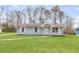 Charming single story home with light blue siding and a well maintained lawn at 8199 Cousins St, Douglasville, GA 30134
