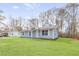 Lovely home with an inviting entrance and a spacious green lawn at 8199 Cousins St, Douglasville, GA 30134