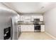 Modern kitchen featuring stainless steel appliances, ample counter space, and stylish finishes at 8199 Cousins St, Douglasville, GA 30134