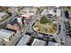 An aerial shot of a city center featuring historical buildings, greenery, and parked cars at 15 Mary Jane Ln, Covington, GA 30016