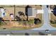 Aerial view of a home with a long driveway, a fenced-in backyard and green trees at 15 Mary Jane Ln, Covington, GA 30016