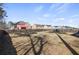 A spacious backyard with a wooden fence and mature trees on a sunny day at 15 Mary Jane Ln, Covington, GA 30016