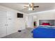 This bedroom features plush carpeting, a ceiling fan, and a convenient en-suite bathroom at 15 Mary Jane Ln, Covington, GA 30016