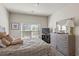 Cozy bedroom featuring neutral walls, carpet flooring, and a bright window at 15 Mary Jane Ln, Covington, GA 30016