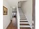 Inviting entryway with hardwood floors and staircase leads to the upper level at 15 Mary Jane Ln, Covington, GA 30016
