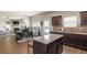 Gourmet kitchen with stainless steel appliances, a functional island, and an adjoining dining space at 15 Mary Jane Ln, Covington, GA 30016