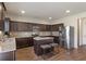 Beautiful kitchen boasts stainless steel appliances, stylish countertops, and ample cabinet space at 15 Mary Jane Ln, Covington, GA 30016