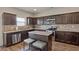Well-equipped kitchen with a functional island, granite countertops, and stainless steel appliances at 15 Mary Jane Ln, Covington, GA 30016