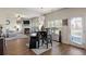 The open-concept layout connects the kitchen, dining area, and living room with a fireplace at 15 Mary Jane Ln, Covington, GA 30016