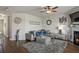 Cozy living room features a fireplace, modern decor, and ample seating for relaxation and entertaining at 15 Mary Jane Ln, Covington, GA 30016