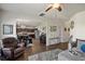 Inviting open-concept living area showcases hardwood floors and seamless flow to the kitchen at 15 Mary Jane Ln, Covington, GA 30016