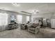 Spacious main bedroom with tray ceilings, carpeting, sitting area, and abundant natural light at 15 Mary Jane Ln, Covington, GA 30016