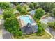 Community amenities showcasing a pristine swimming pool, tennis courts, and a clubhouse, creating a vibrant atmosphere at 370 Fairleaf Ct, Alpharetta, GA 30022