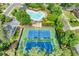 Aerial view of community amenities including tennis courts and a heart-shaped swimming pool, ideal for recreation at 370 Fairleaf Ct, Alpharetta, GA 30022