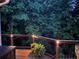 Backyard deck view with evening accent lighting and tree views at 370 Fairleaf Ct, Alpharetta, GA 30022