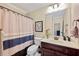 Full bathroom featuring white cabinets, toilet and vanity at 370 Fairleaf Ct, Alpharetta, GA 30022