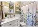 Charming bathroom features a single vanity, updated fixtures, and a shower at 370 Fairleaf Ct, Alpharetta, GA 30022