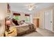 Bedroom with soft carpet, neutral walls and furniture, ceiling fan and two windows at 370 Fairleaf Ct, Alpharetta, GA 30022