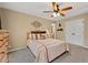 Inviting bedroom featuring a cozy bed, ceiling fan, and stylish wall decor for a relaxing retreat at 370 Fairleaf Ct, Alpharetta, GA 30022