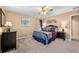 Bedroom featuring soft carpet, neutral walls and furniture, ceiling fan and two windows at 370 Fairleaf Ct, Alpharetta, GA 30022