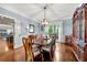 Formal dining room featuring hardwood floors, chandelier, and ample natural light at 370 Fairleaf Ct, Alpharetta, GA 30022