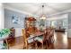 Traditional dining room with hardwood floors, furniture, and elegant decor at 370 Fairleaf Ct, Alpharetta, GA 30022