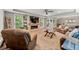 Inviting living room with stone fireplace, recessed lighting, and plush seating at 370 Fairleaf Ct, Alpharetta, GA 30022