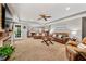 Spacious living room with carpet floors, a ceiling fan, and a decorative fireplace at 370 Fairleaf Ct, Alpharetta, GA 30022