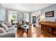 Cozy living room boasts hardwood floors and views to the foyer and front yard at 370 Fairleaf Ct, Alpharetta, GA 30022
