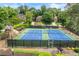 Community tennis courts with well-maintained surfaces and comfortable spectator seating, perfect for an active lifestyle at 370 Fairleaf Ct, Alpharetta, GA 30022