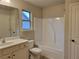 Bathroom boasts a tub shower combination, single sink vanity, and neutral tones at 3818 Southfield Ct, Loganville, GA 30052