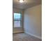 Clean bedroom with carpet flooring and a large window for natural light at 3818 Southfield Ct, Loganville, GA 30052