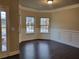 Dining area featuring a bay window, chair rail molding, and hardwood floors at 3818 Southfield Ct, Loganville, GA 30052