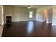 Large living room featuring hardwood floors, a fireplace, and natural light at 3818 Southfield Ct, Loganville, GA 30052