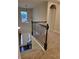 Carpeted staircase features decorative iron spindles and a large window for natural light at 3818 Southfield Ct, Loganville, GA 30052