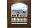 Arched window with beautiful exterior view of the front of another house at 3818 Southfield Ct, Loganville, GA 30052