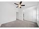 This bedroom features neutral walls and carpet with two entry doors at 1245 Liberty Nw Pkwy # 807, Atlanta, GA 30318